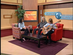 Another snapshot of Jonathan Cabrera getting set to perform on the Miami-Dade Connected television show, with host Johanna Gomez and Juan Carlos Vera watching.