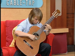 Jonathan Cabrera performs Asturias during a recording of  Cable television program Miami-Dade Connected, with host Johanna Gomez.